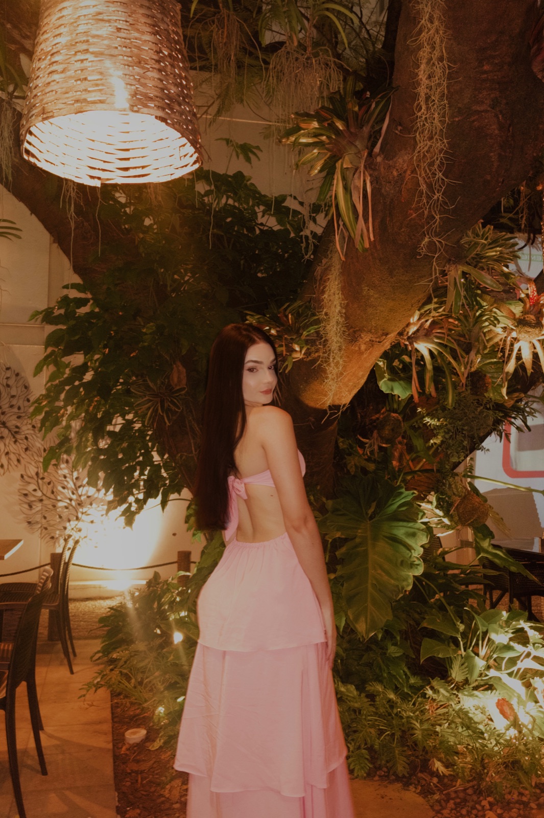 Sarah outdoors in a pink dress